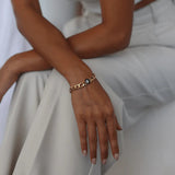 titan and gold lunar curb bracelets