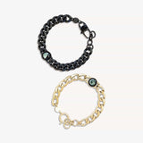 titan and gold lunar curb bracelets